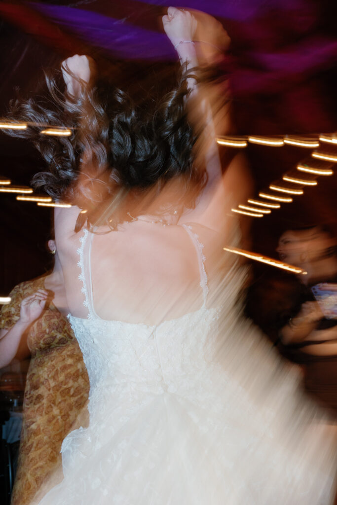 Light trails around a dancing bride.