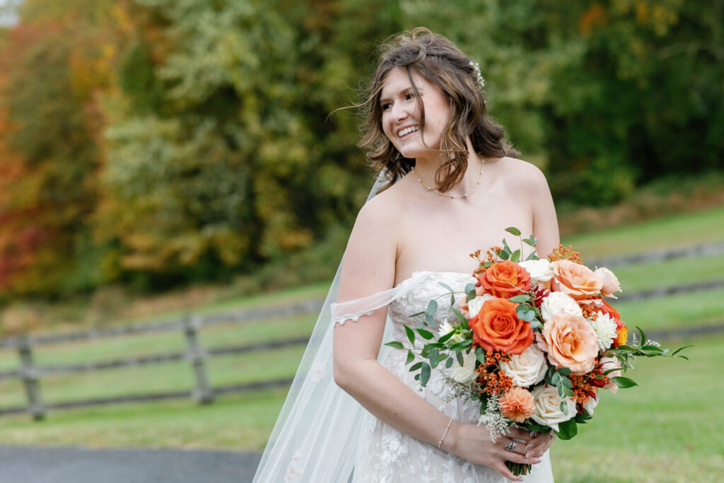 A fall bride with her bouquet.